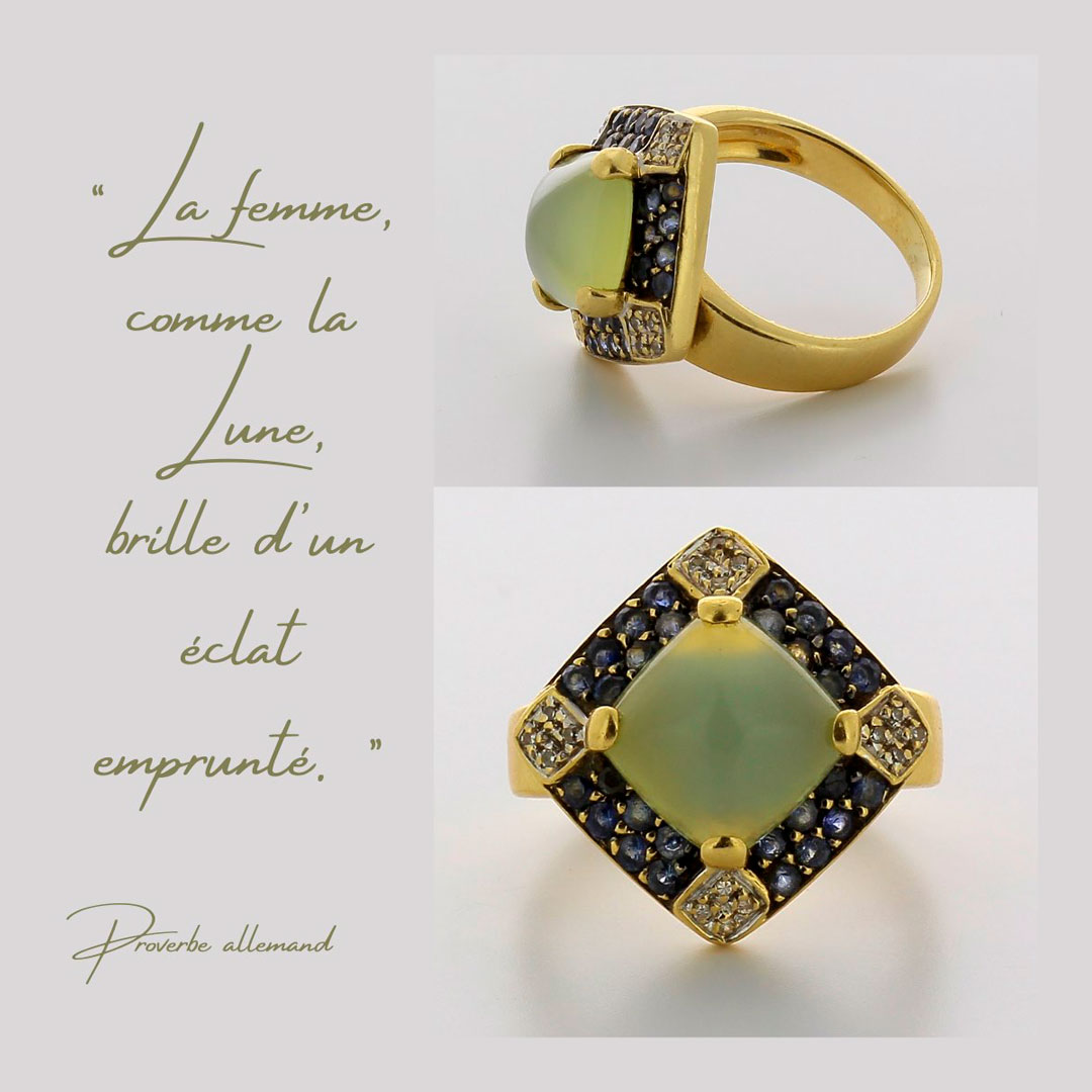 Bague en or jaune 750 ‰ présentant une pierre de lune avec pavage de saphirs et diamants